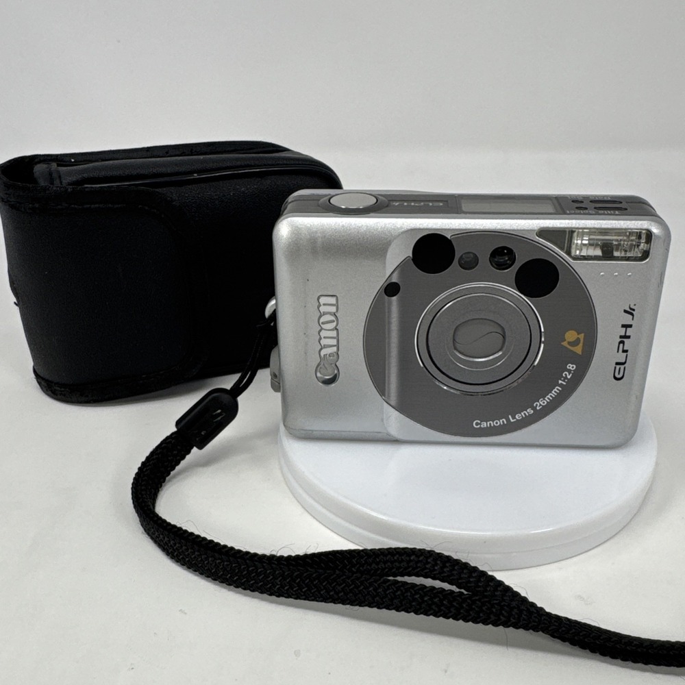 CANON Elph Jr. APS Film Camera, 26mm f2.8 Wide Angle Lens, Silver w/‎ Case WORKS